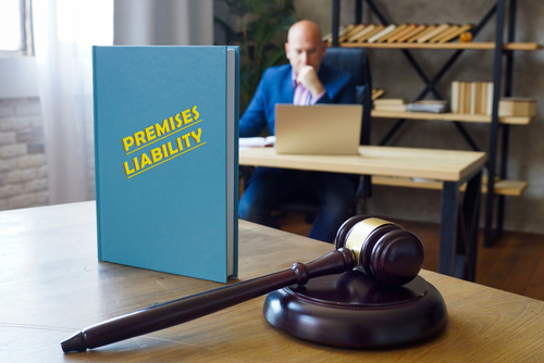 Premises liability law book with gavel on desk in lawyer’s office