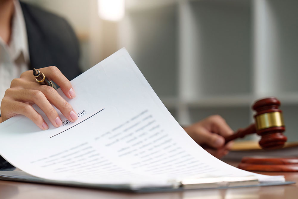 Legal professional reviewing documents in a law office