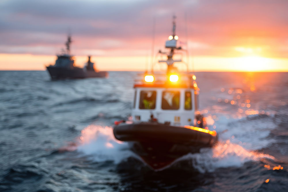 Fast-moving boat on open water representing boating accident risk and maritime injury claims