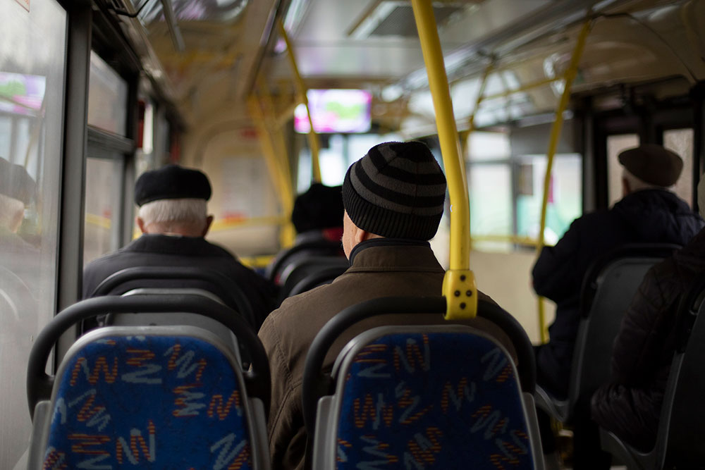 Passengers seated inside a public bus