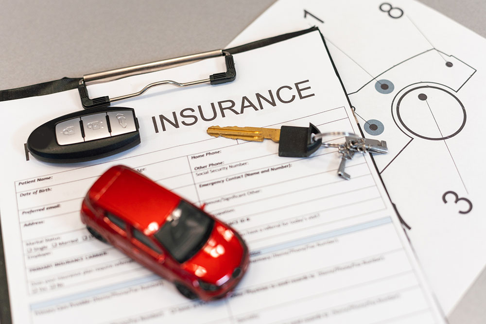 Car insurance claim form and policy documents for uninsured motorist coverage
