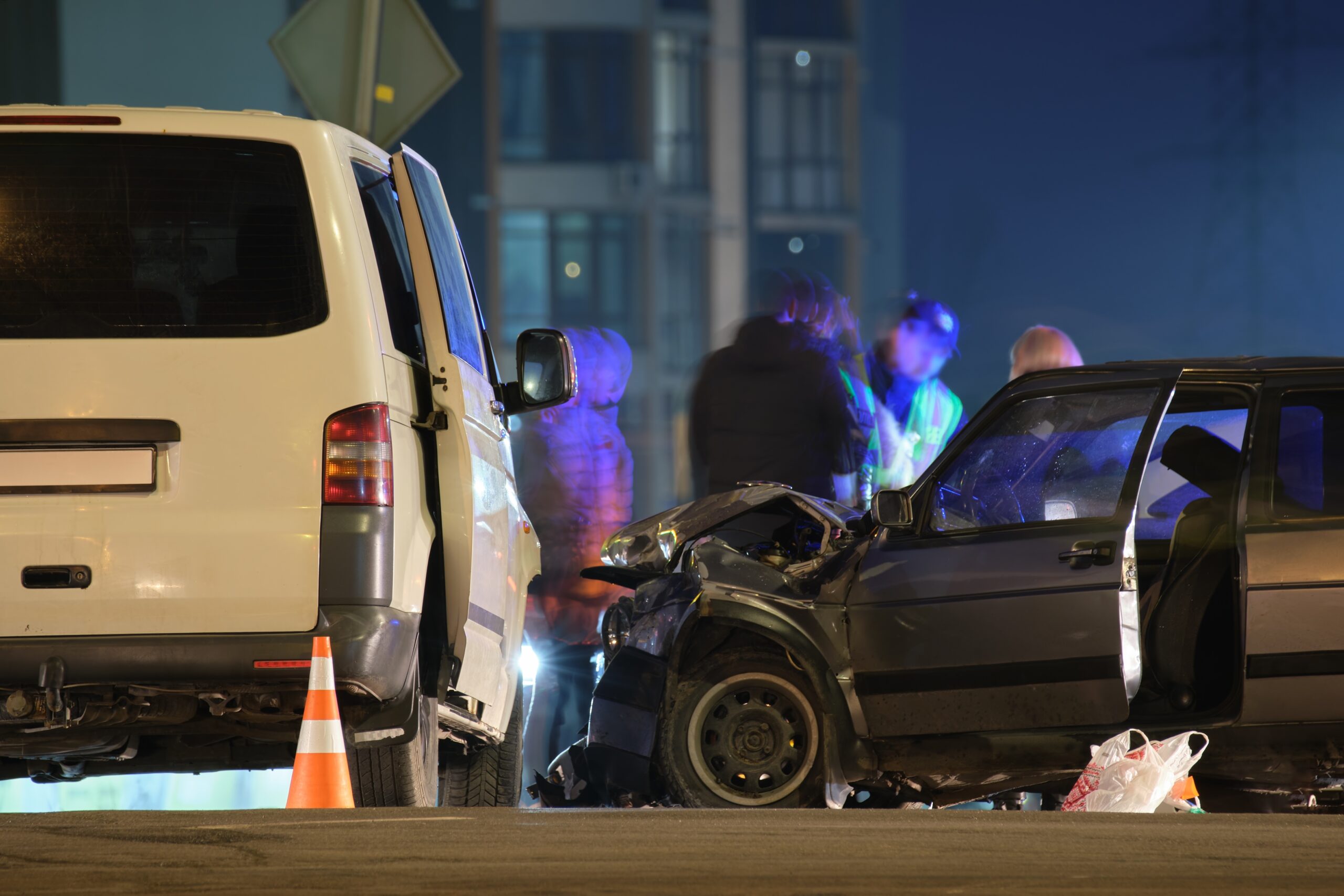 Two vehicles involved in a collision at night with emergency responders assisting after a car accident in Tampa Florida