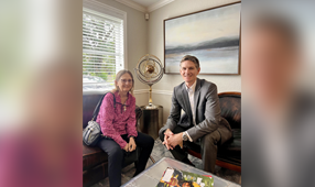 John with his client in office