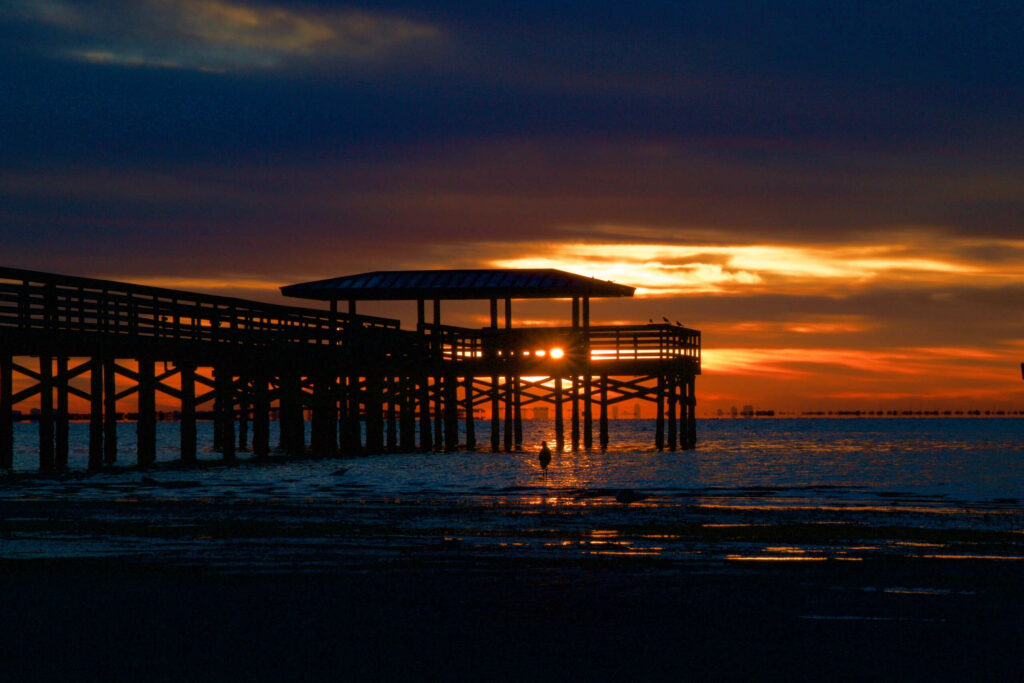 Safety Harbor pier at sunset representing local legal representation by Safety Harbor motorcycle accident lawyers.