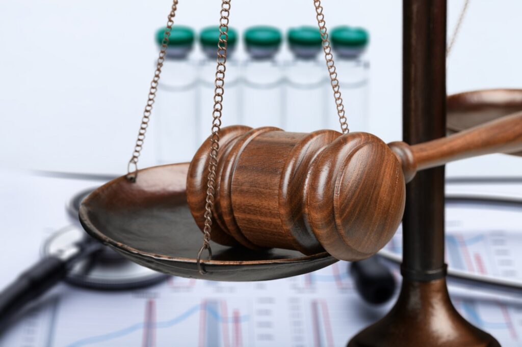 Scales of justice holding a wooden gavel, representing Palm Harbor personal injury lawyers.