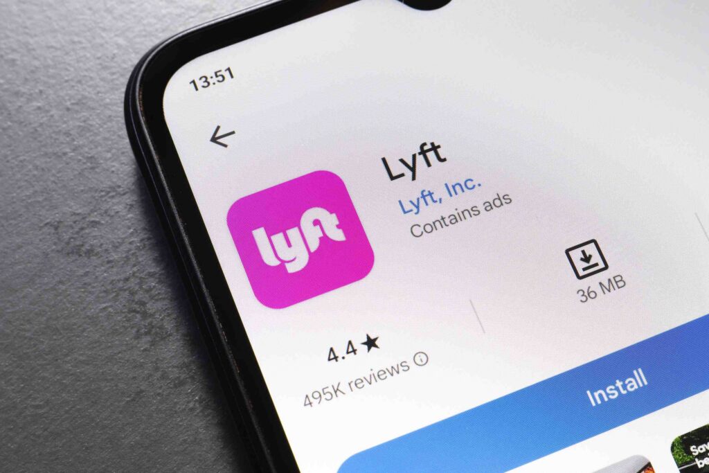 A mobile phone screen displaying the Lyft app download page relates to Inexperienced Lyft Drivers in St. Petersburg.