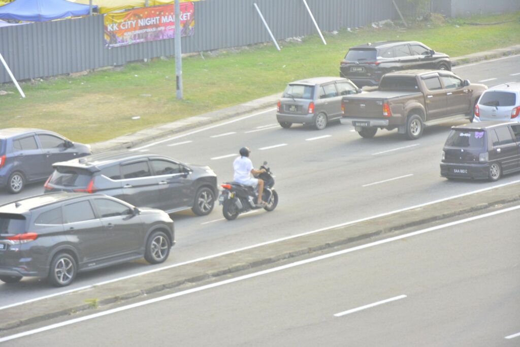 A police officer investigating a wreckage site following Left Turn Motorcycle Crashes on Dale Mabry and Hillsborough Avenue.