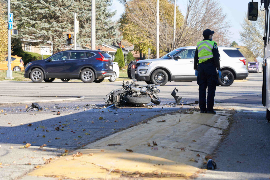 A motorcyclist riding through a busy multi lane intersection illustrating Left Turn Motorcycle Crashes on Dale Mabry and Hillsborough Avenue.
