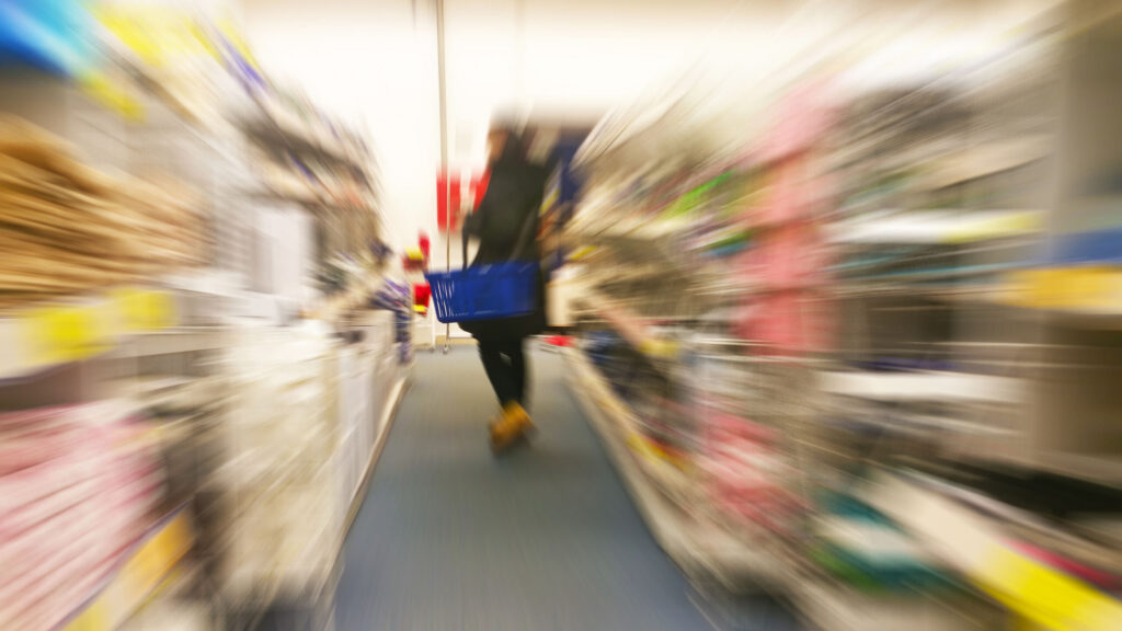 A blurred view of large store aisles where Slips and Falls at New Port Richey Local Retailers and Supermarkets can occur.