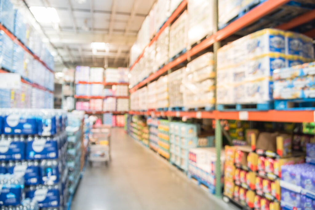 A person walking through a blurred store aisle highlighting risks of Slips and Falls at New Port Richey Local Retailers and Supermarkets.