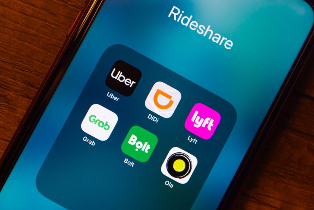 A smartphone screen displaying rideshare application icons when your Tampa Uber driver was logged into three apps at once.
